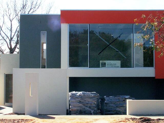 Modern rendered home. Render and feature panels finished on a contemporary new build.