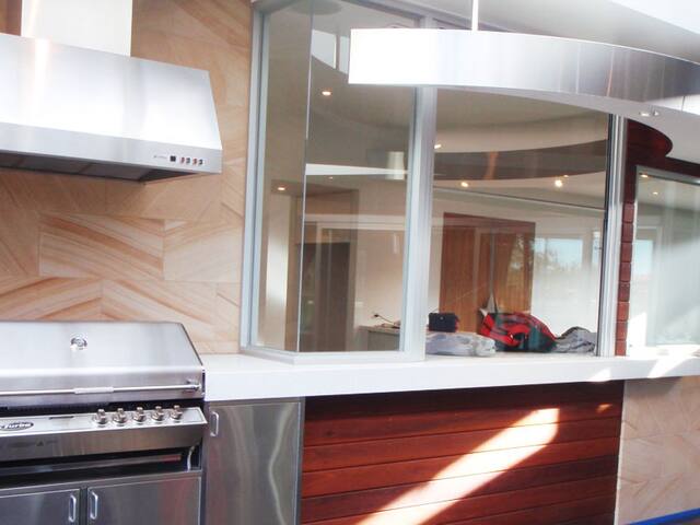 Kitchen and servery. Walls and ceilings painted around a renovated kitchen.