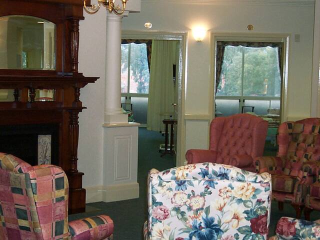 Period living room. Repaint of a period home's living room, fireplace and trims.