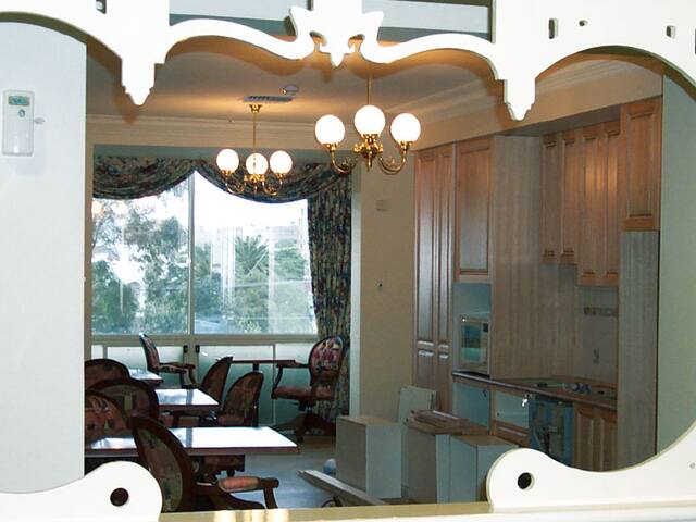 Decorative arch and mirror. Ornate archwork and joinery picked out by hand.