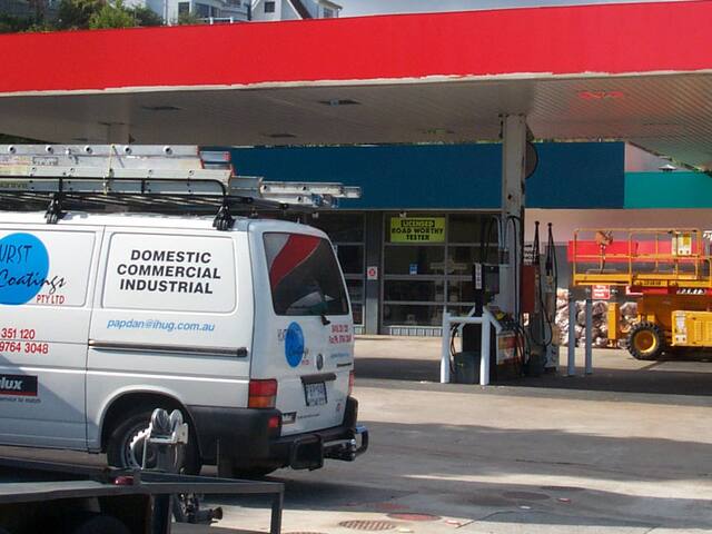 Service station repaint. Canopy and building repaint on a working service station.