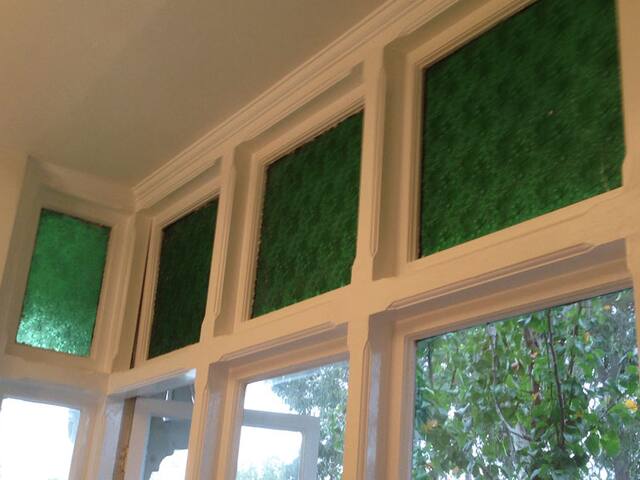 Leadlight windows. Frames painted carefully around original leadlight glass.